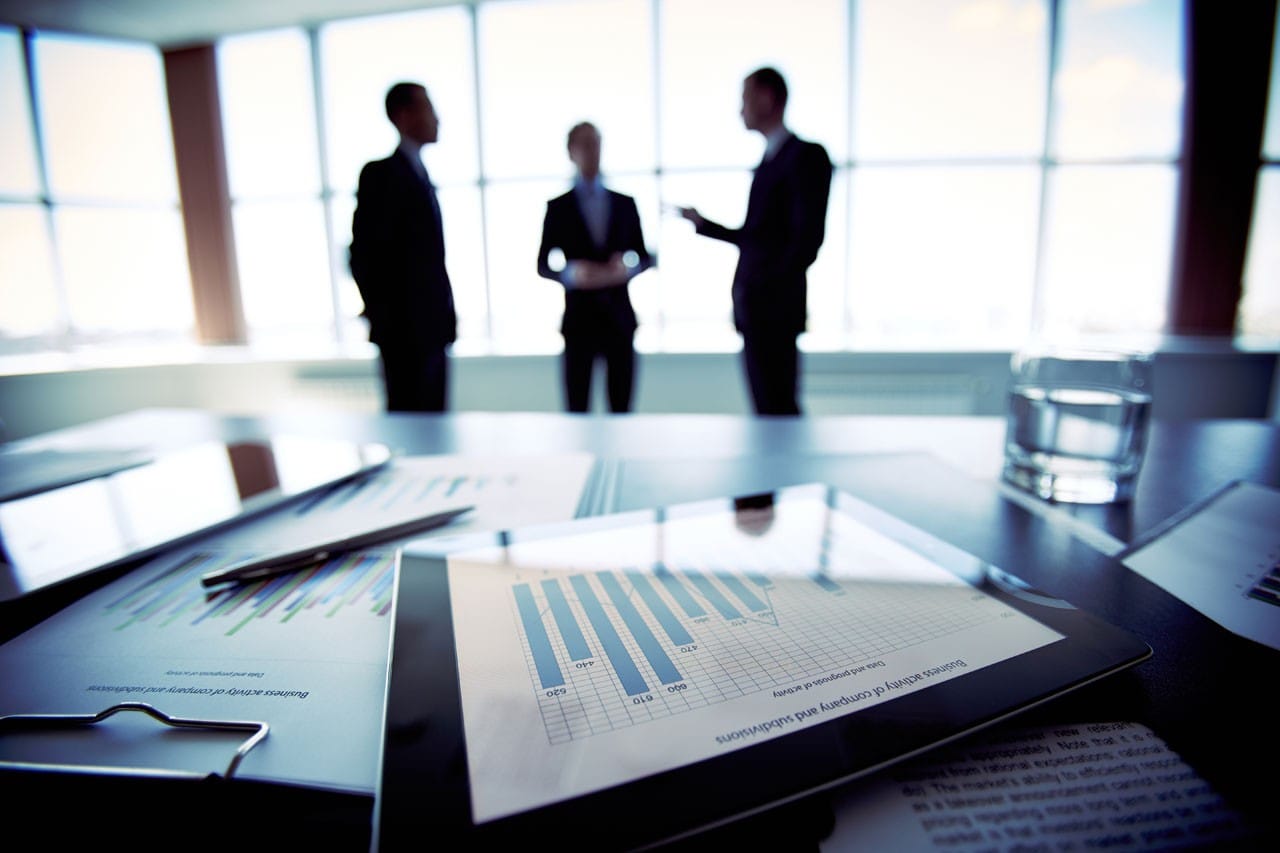 Businessmen conferring